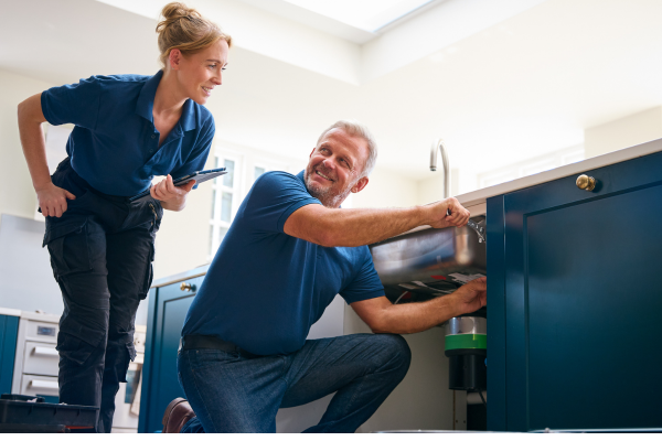 Fix N Flow plumbers repairing kitchen sink waste disposal in Glasgow